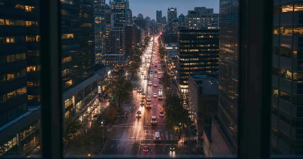 A rideshare driver using a smartphone app while parked on a busy urban street at dusk